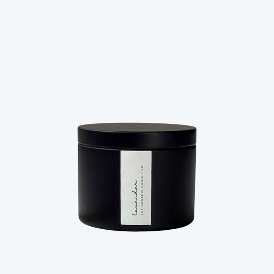 Black candle jar with a white label featuring 'The Organic Candle Co.' on a white background