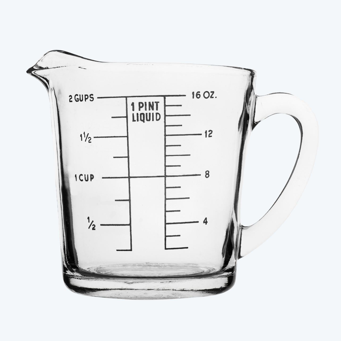 Clear glass measuring cup with measurement markings on a neutral background